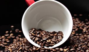 Coffee mug with coffee beans