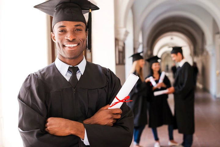 college graduate holding his diploma | Puente Hills Subaru in City of Industry CA