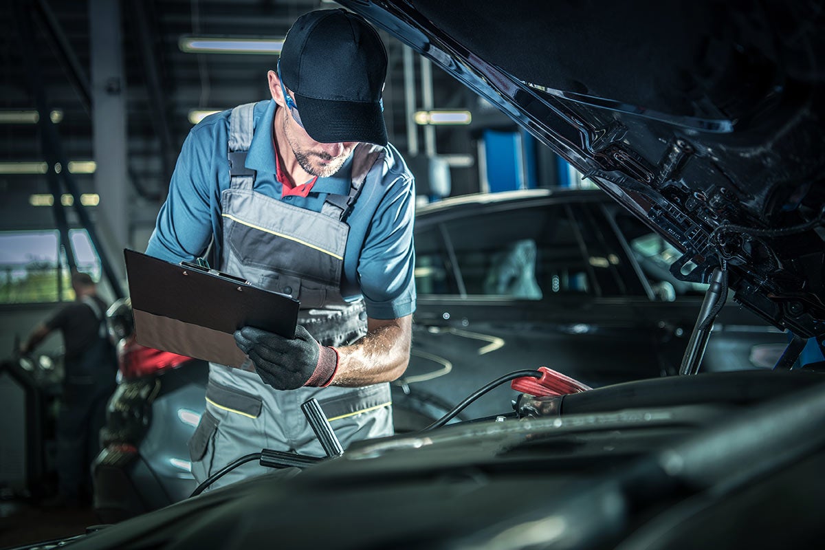 Mechanic checking vehicle